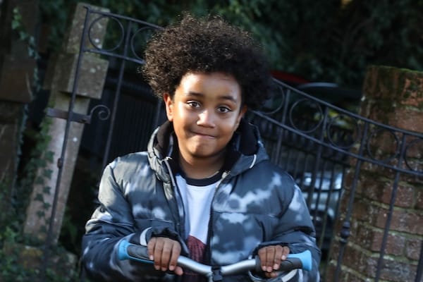 What About My Kids? — a child outside St Mary's